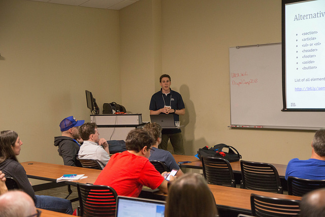 Ben presenting a slide titled 'Alternatives to Divs' during his session at DrupalCamp Asheville.